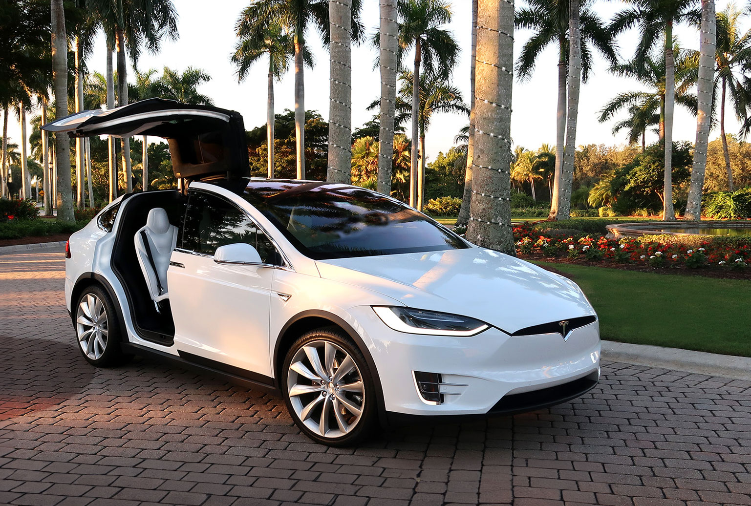 White Tesla airport transportation and taxi service in North County San Diego
